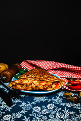 Black wheat and wheat galette topped with cooked ham and emmental cheese