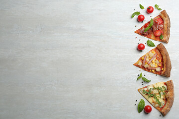 Slices of different delicious pizzas on light grey table, flat lay. Space for text