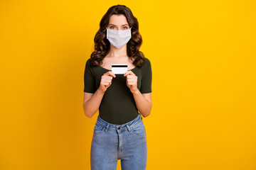 Portrait of her she nice attractive content wavy-haired girl wear safety mask holding hand bank...