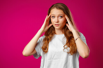 Naklejka premium Young beautiful woman suffering from headache with hands on head