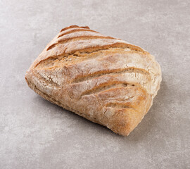 Whole bread over concrete background