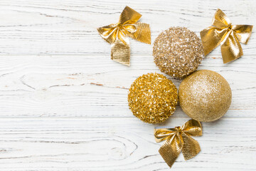 Creative set of New Year baubles and decorations on wooden background. Top view of Christmas time...