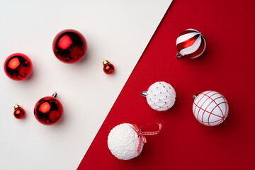 Christmas baubles on red and white paper background