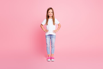 Fototapeta na wymiar Full length photo of nice adorable kid girl enjoy spring weekend rest relax put hands pockets wear good look clothes footwear isolated over pink color background