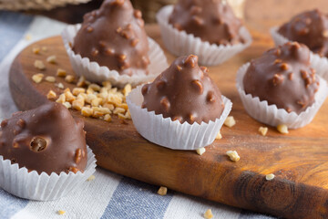Small chocolate sweets with nuts close up