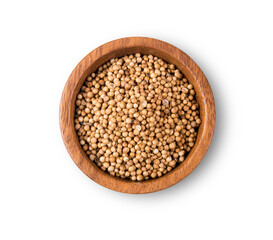 Dried coriander seeds top view on white background