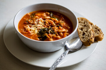 Homemade Ribollita, tuscan bean soup with light rye ciabatta