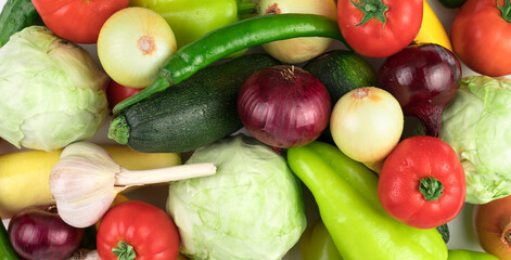 Panorama of different fresh ripe vegetables in a wide variety with water drops. Food background. The view from the top. The concept of natural products, proper nutrition.