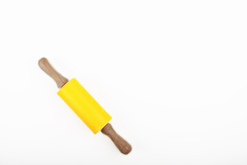 silicone resin rolling pin with wooden handles isolated on white background flat lay