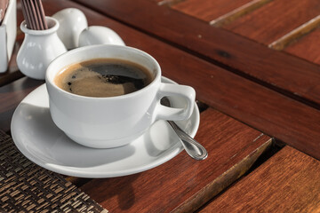 White cup of hot espresso coffee