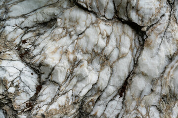 Natural pattern of white marble texture or background with black and yellow wavy lines..