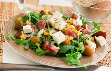 fresh vegetarian healthy vegetable salad with arugula and chees