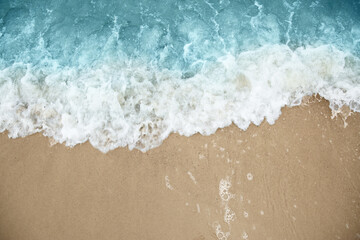 Fototapeta na wymiar Beautiful view of sea tide on sandy beach. Summer vacation