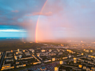 Rainbow and rain over Kiev city. Aerial drone view.