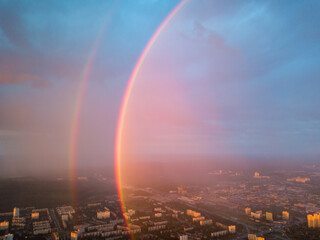 Aerial drone view. Double rainbow on a rainy evening over Kiev city.