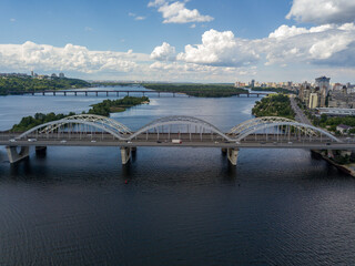 Obraz premium Aerial drone view. Darnitsky railway and automobile bridge in Kiev.