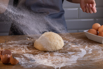 Chef preparing a portion of fresh dough. Cooking dumplings – step by step guide.