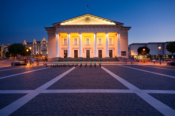 Night view of illuminated Town Hall in the Town Hall Square in the Old Town of Vilnius, Lithuania