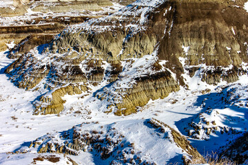 Snow starts to melt in Horseshoe Canyon, Drumheller, Alberta, Canada