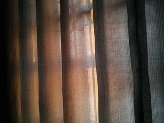 Fototapeta premium Sunlights through transparent curtains in bedroom