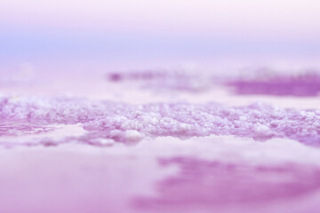 Crystallized salt natural mineral formation at pink salt lake Sivash. Concept nature and spa