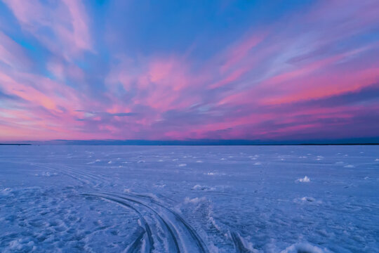 landscape with purple blue sunset on a winter evening over the river