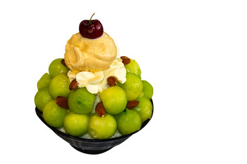 shaved ice or snowflake dessert topped with fruit such as cantaloupe melon cherries and ice cream in bowl (asian or korean japan dessert call bingsu) isolated on white with clipping path