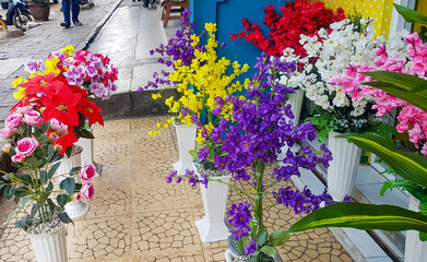 Colorful plastic flowers for home decoration and interior 