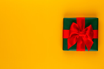 Christmas, holiday present box on red background.