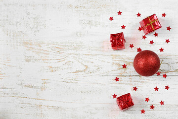 Christmas background. Balls, stars, gifts. Preparing for the new year. Top view. New year concept. Flat composition with Christmas decorations on a wooden background, place for text.