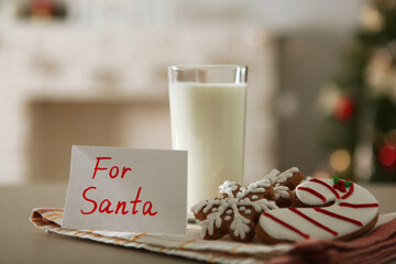 milk and Christmas cookies for Santa on the table. Christmas background