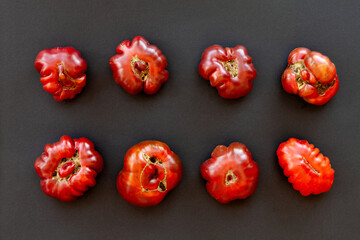 Top view of tomatoes bottoms. Shapes of organic vegetables. Purple calabash tomato heirloom.