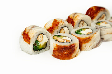 Sushi roll with eel and chuka salad on a white plate, classic Japanese sushi. Traditional Japanese food with maki. Delicious pieces of sushi. For the restaurant menu. copyspace