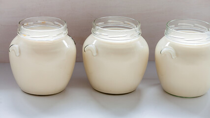Jars with freshly made soy milk. Homemade vegan plant milk. Asian cuisine.