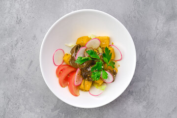 Salad with chicken liver, radish, pumpkin, tomato and mustard