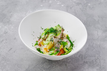 Salad with herring, boiled potato, onion, celery and egg