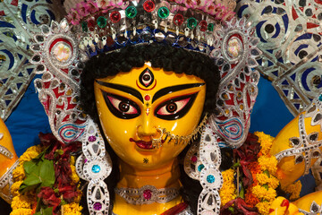 Close up of the beautiful face of Hindu Goddess Durga with use of selective focus.