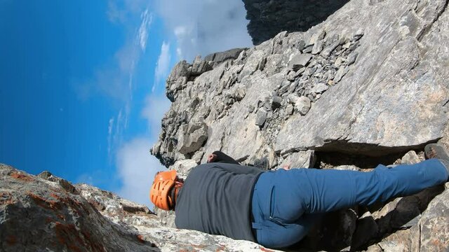 POV going down at climbing expedition mountainering on Olymp mountain in Greece, vertical orientation