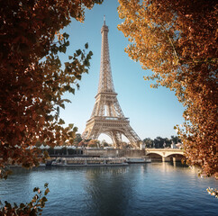 Fototapeta na wymiar Seine in Paris with Eiffel tower in autumn time