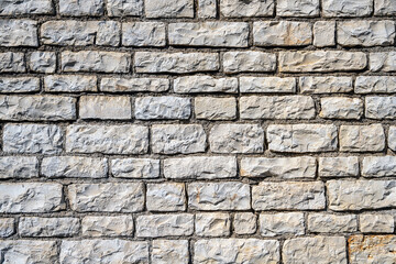 Background from an uniform natural stone wall