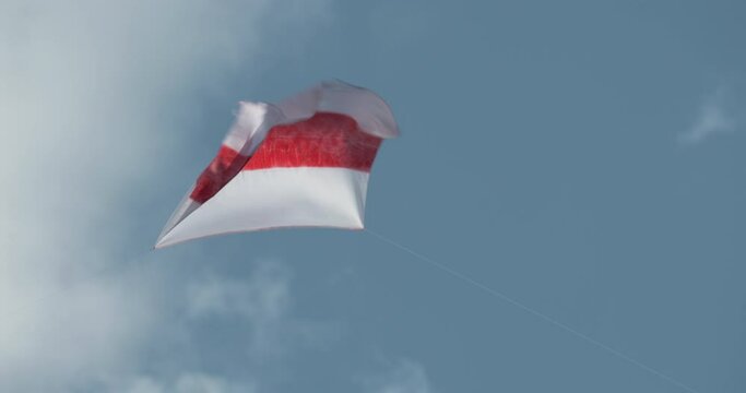 Flag of Belarus. A white-red-white flag made of fabric moves in the wind. Symbol civil protest in Belarus against violence in civil society. Elections in Belarus.