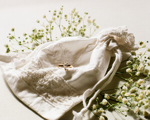 Engagement ring on cotton drawstring bag with Baby's Breath flowers