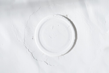 Round frame from white powder or flour with shadow.