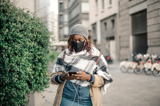 black woman in town with mask