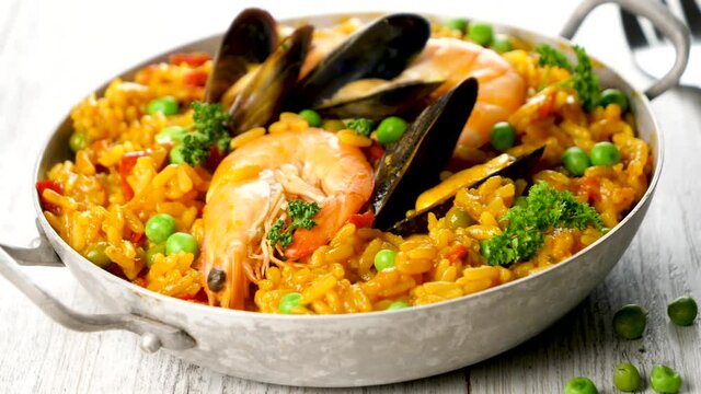 paella with shimpr, mussel, pea and rice