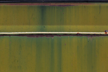 Weathered green paint on metal