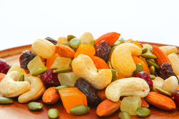 The plate contains nutritious mixed nuts