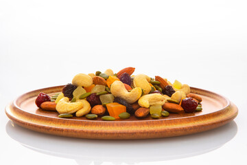 The plate contains nutritious mixed nuts