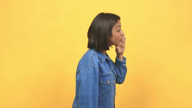 Young indian woman whispering gossip undertone, trying not to be heard