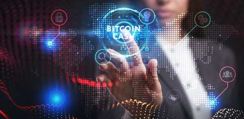 Business, Technology, Internet and network concept. Young businessman working on a virtual screen of the future and sees the inscription: Bitcoin cash